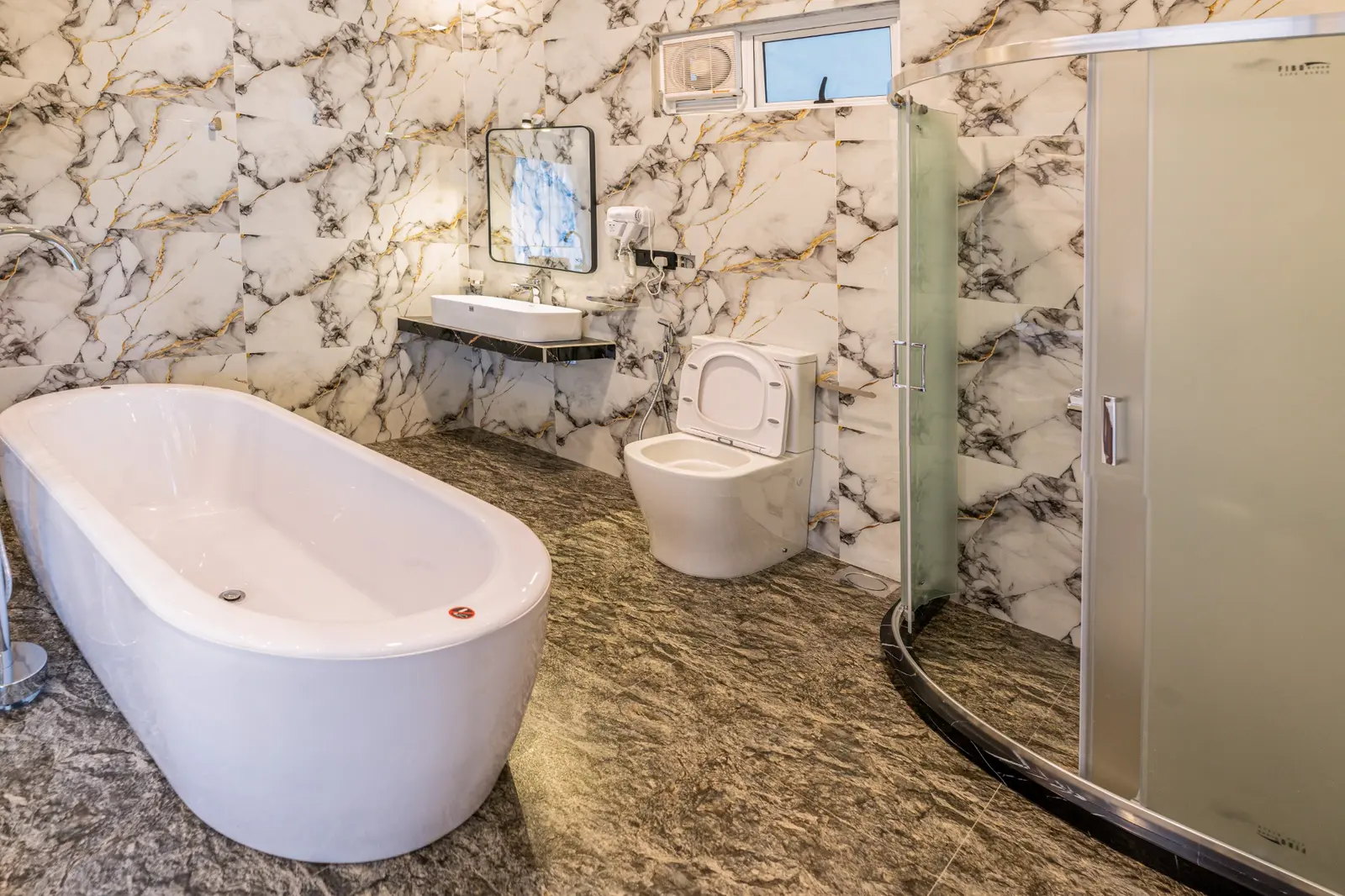 Spacious premium bathroom with a freestanding bathtub
