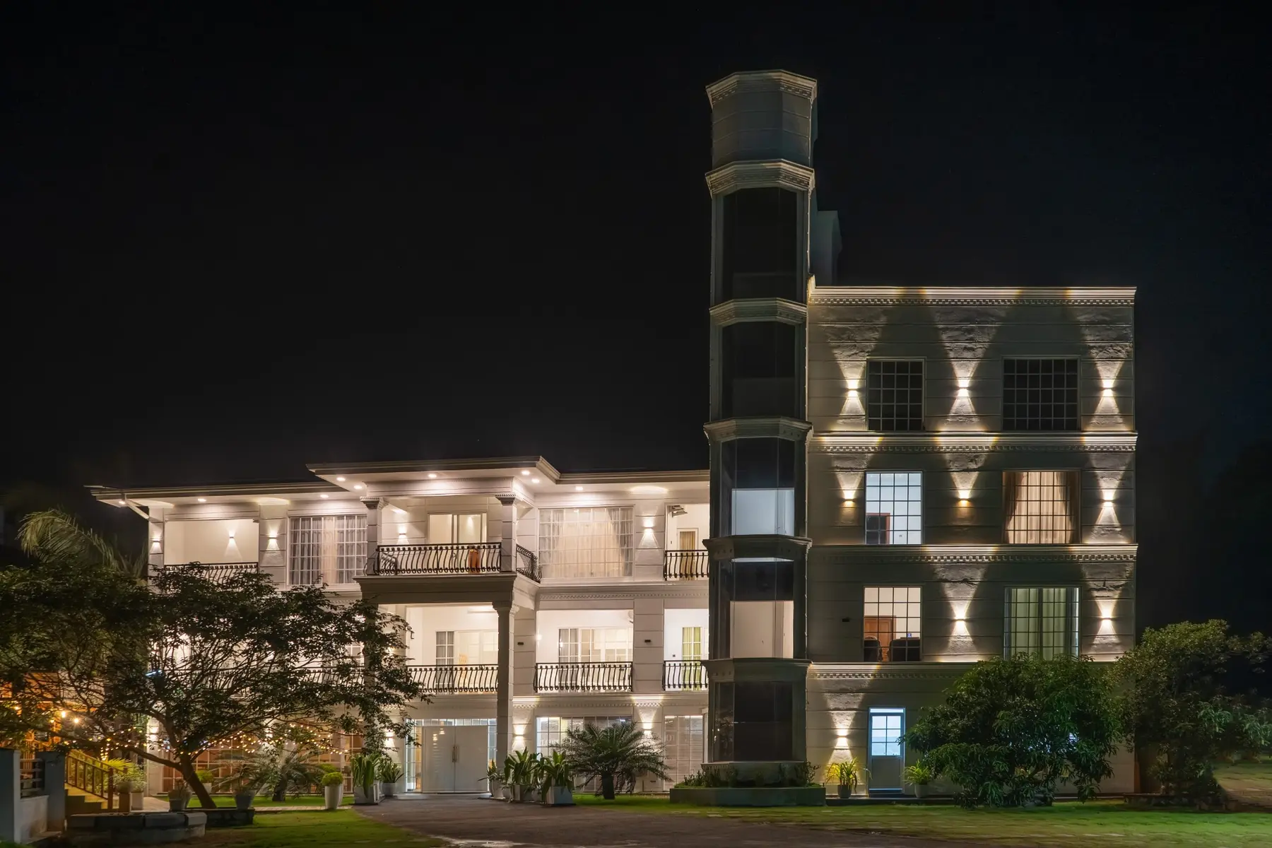 White Land City Hotel illuminated at night